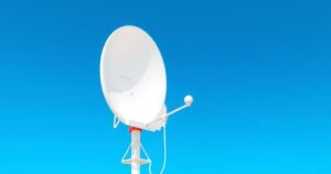 A satellite dish against a clear sky symbolizes global communication and technology advancements in connectivity.