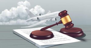 A conceptual illustration of a gavel, court documents, and an airplane amidst a cloudy sky, symbolizing legal disputes.