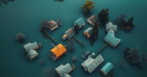 Aerial view of flooded landscape in Venezuela, showcasing waterlogged homes and surrounding greenery.