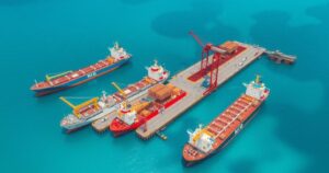 Aerial view of an LNG export port with ships and infrastructure, showcasing blue waters and clear skies.
