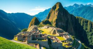 Breathtaking view of Machu Picchu with lush green mountains in serene colors under a clear blue sky.